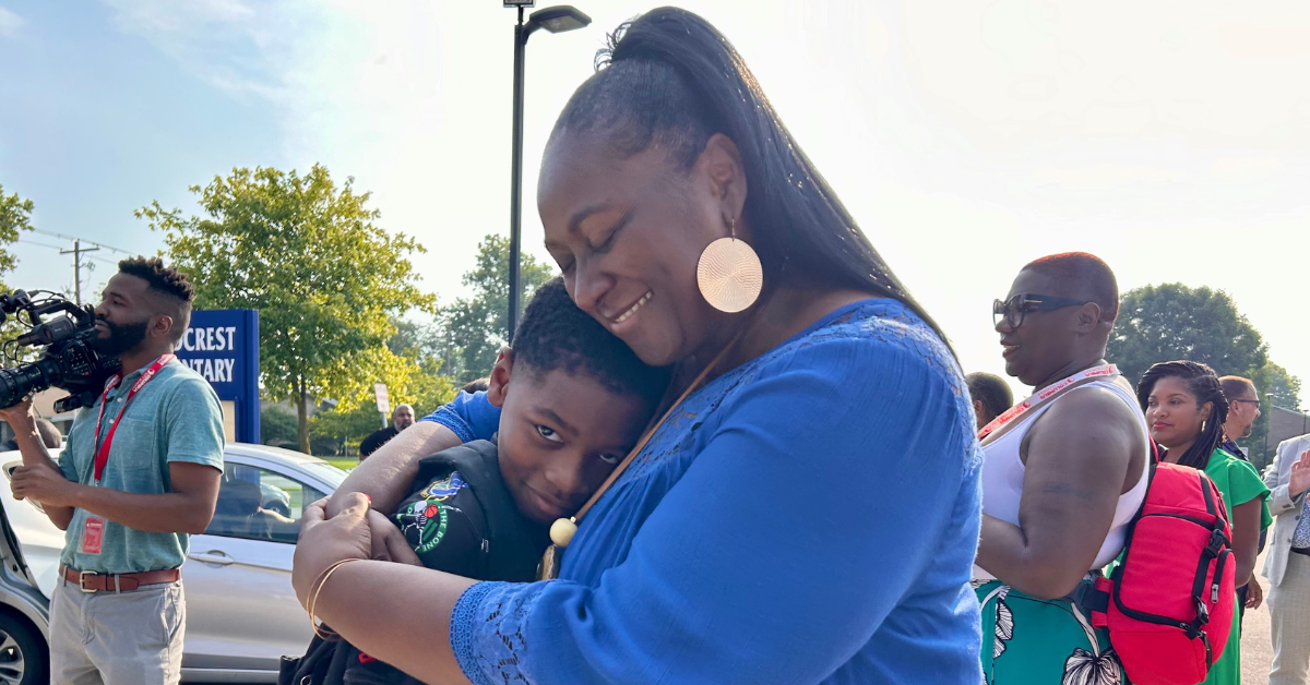 principal hugging student